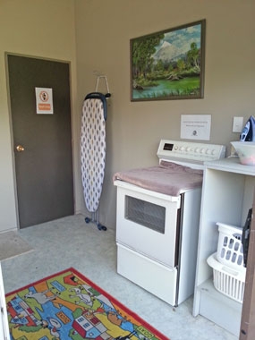 laundry room with iron board